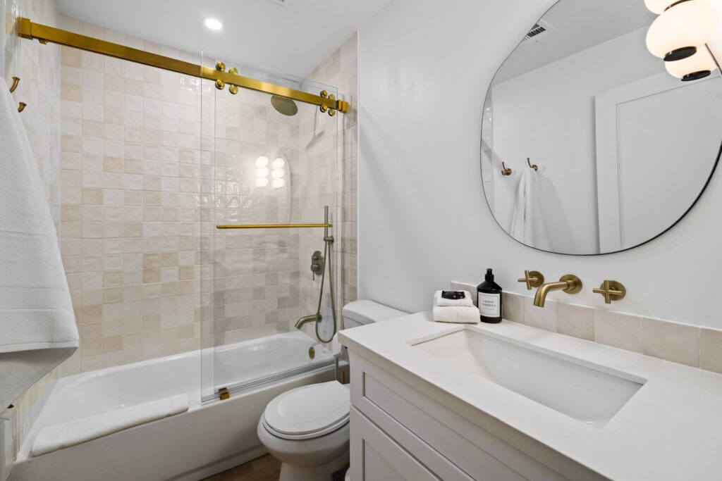Remodeled bathroom with gold accents,