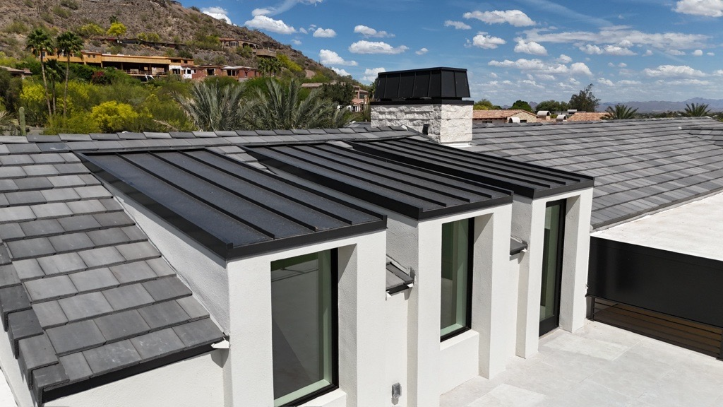 Modern Arizona roofs featuring sleek metal and tile roofing designed to withstand desert heat and weathering.