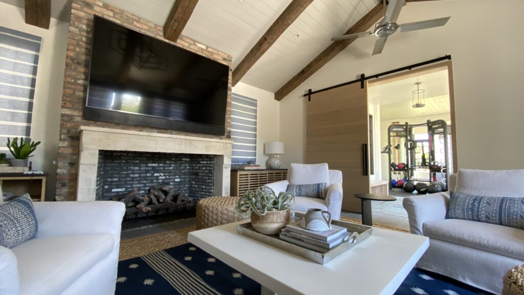 Open flex space in a modern Phoenix home, staged for both exercise and relaxation, showcasing the trend of multi-use rooms in 2025.